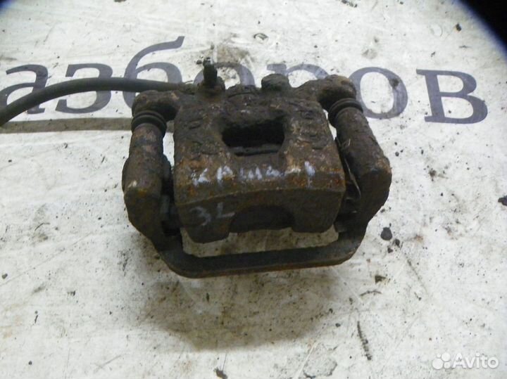 Суппорт тормозной задний левый Nissan Qashqai