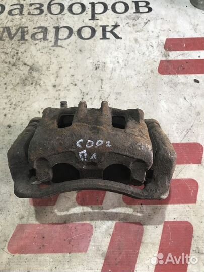 Суппорт тормозной передний левый Kia Sorento II (2