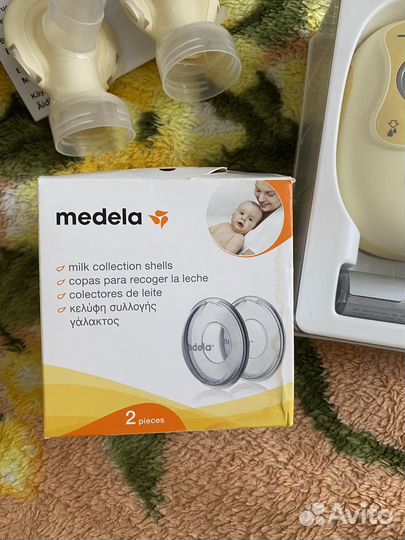Молокоотсос medela электрический