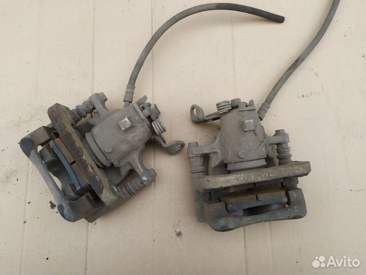 Суппорт тормозной задний Опель Инсигния