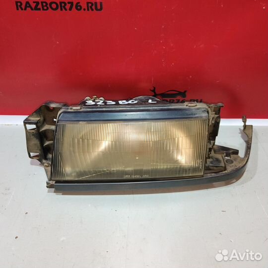 Фара левая Mazda 323 BG седан
