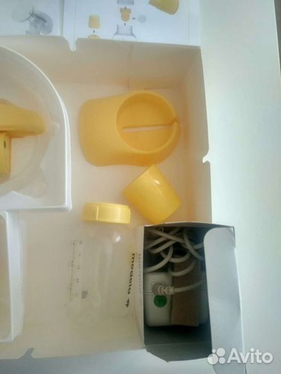Молокоотсос medela электрический