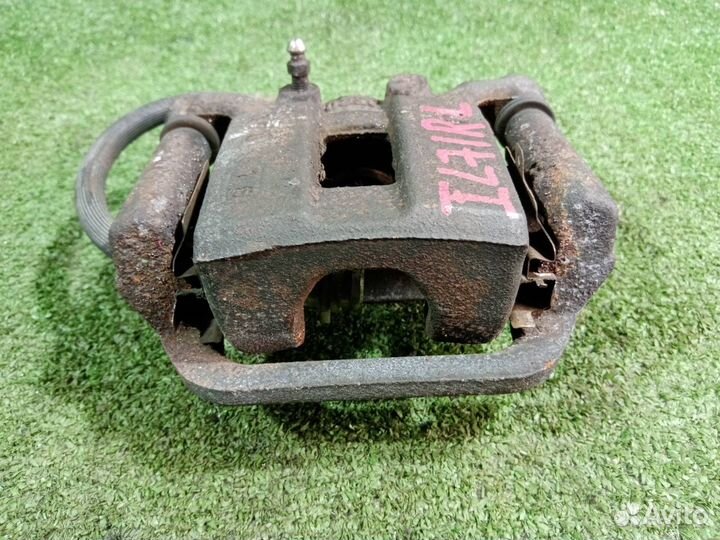 Суппорт тормозной задний левый Nissan X-Trail NT31