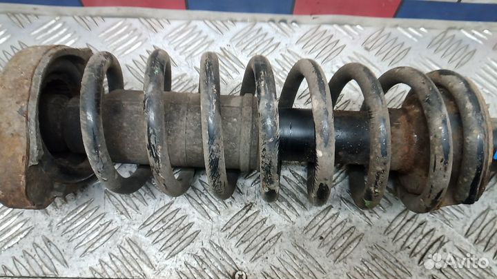 Стойка амортизатора заднего левого Mitsubishi Outlander