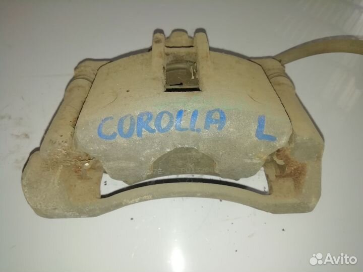 Суппорт передний левый Тойота Королла 120