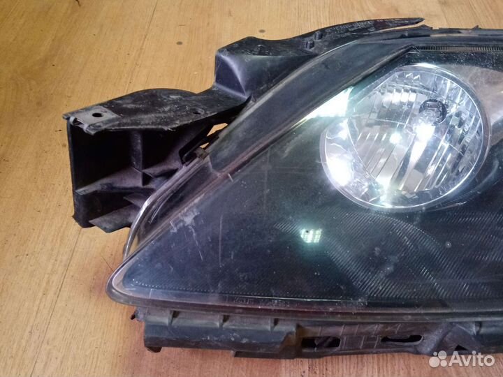 Фара левая Mazda Cx-7 EH1151040