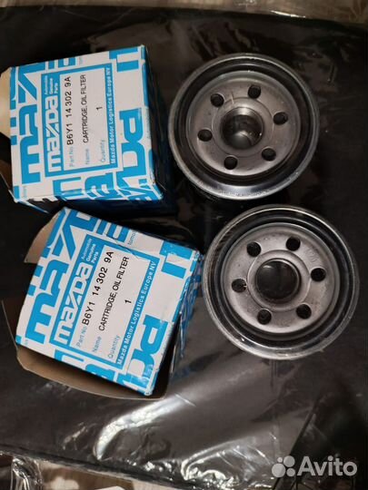 Масляный фильтр на MazdaB6Y1 14 302 9A