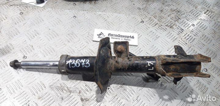 Амортизатор передний левый ориг. Nissan Tiida C11