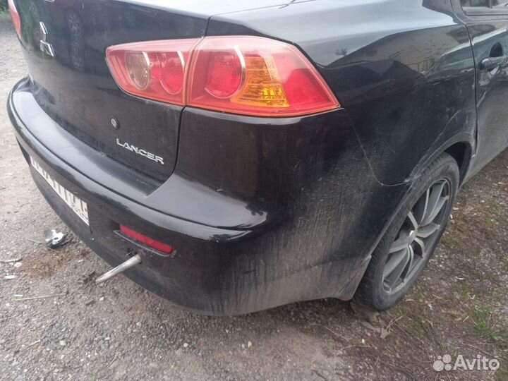 Задний бампер Mitsubishi Lancer 10