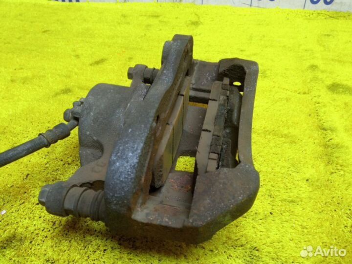 Суппорт передний левый Nissan/Mitsubishi