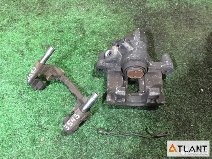 Суппорт задний правый mazda axela