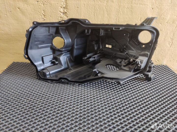 Корпус фары левый Toyota Land Cruiser 300