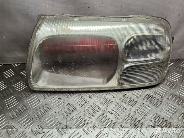 Стекло левой фары Suzuki Grand Vitara 2003г