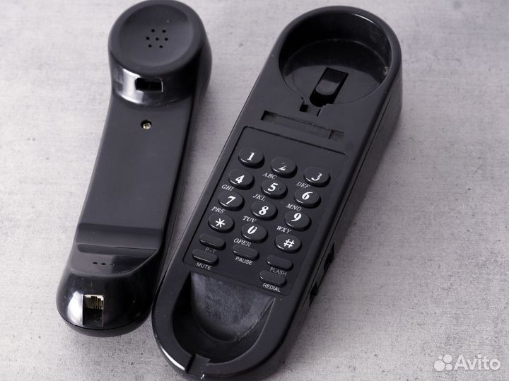 Стационарный телефон с кнопками на детали