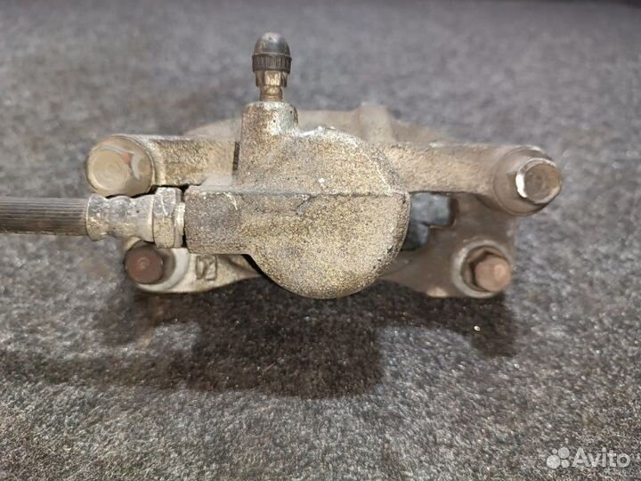 Суппорт тормозной задний правый Mitsubishi Lancer