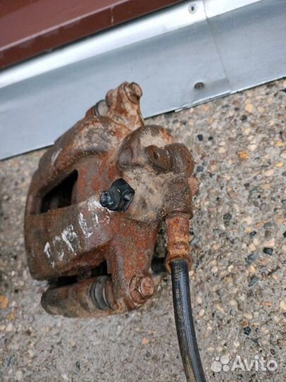 Суппорт тормозной передний правый Fiat Doblo