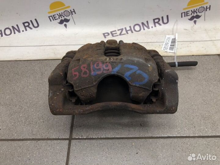 Суппорт тормозной передний левый Nissan Note