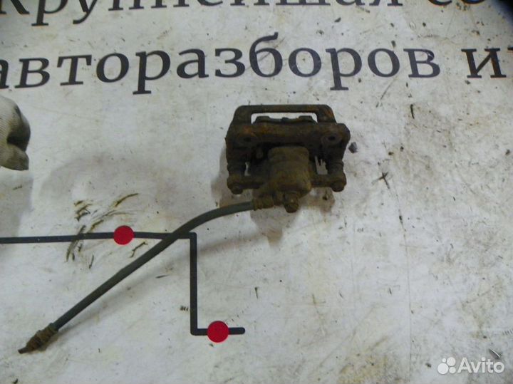 Суппорт тормозной задний левый Hyundai Tucson