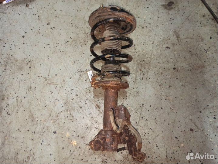 Стойка подвески передняя левая Nissan Primera P12