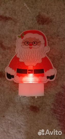 Игрушка дед мороз горит