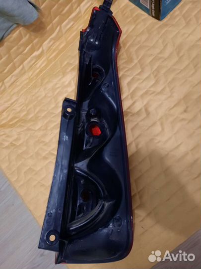 Фонарь левый Nissan Note 2011 рейстайлинг