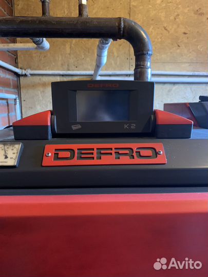 Автоматический твердотоплевный котел Defro