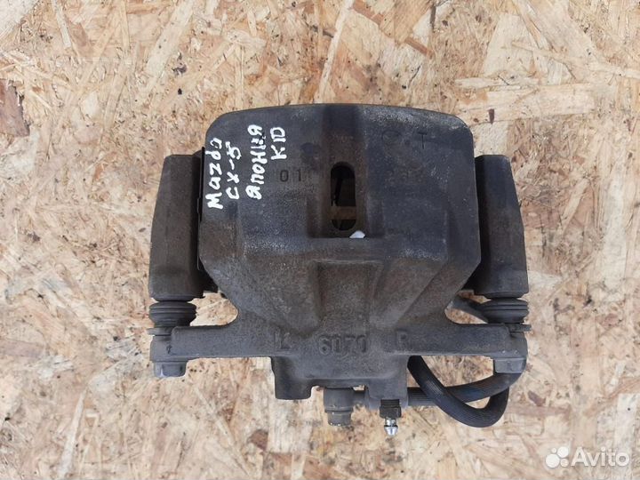 Суппорт тормозной передний левый Mazda CX-5 KE