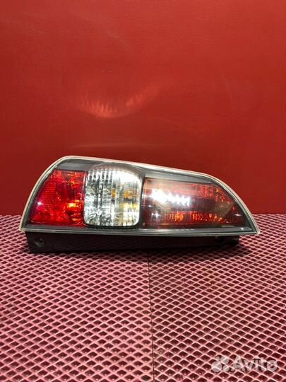 Фонарь задний левый Daihatsu Sirion M3 1KR-FE 2010