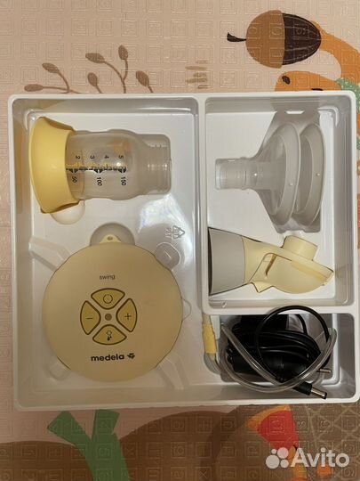 Молокоотсос medela swing