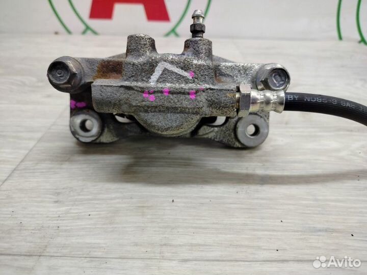 Суппорт тормозной задний левый Mitsubishi Lancer