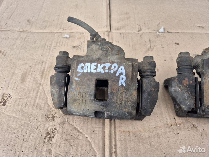 Суппорт передний Kia Spectra