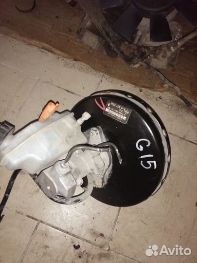 Вакуумник с главным цил в сборе Nissan Almera G15