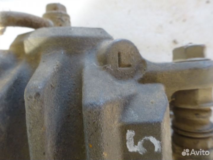 Суппорт тормозной задний левый Subaru Outback B14