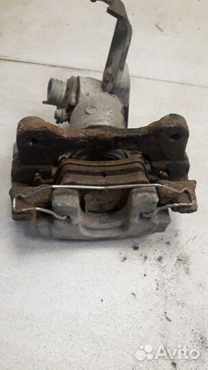 Суппорт задний правый Nissan Primera