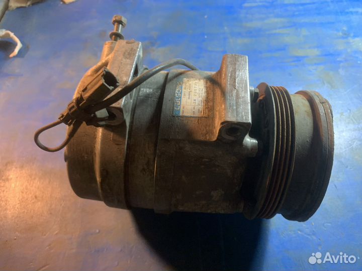 Компрессор кондиционера subaru 73011aa090