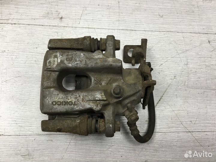 Суппорт тормозной задний правый Toyota Corolla