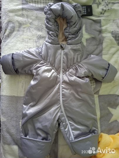 Конверт и комбинезон новорожденного