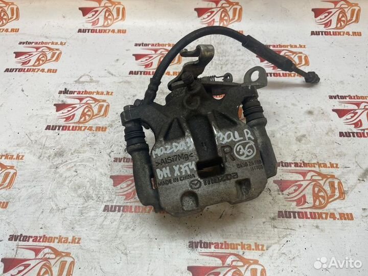 Суппорт тормозной задний правый Mazda 3 BM хетчбек