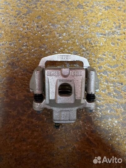 Суппорт тормозной задний левый T600 мех. Ручник