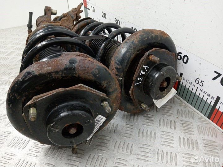 Стойка амортизатора переднего левого Nissan Primera