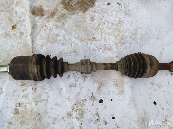 Приводной вал левый Мицубиси Лансер 9 МКПП