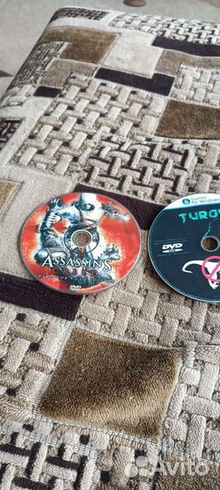 Диск с играми ассасин Крид и Turok цена 600