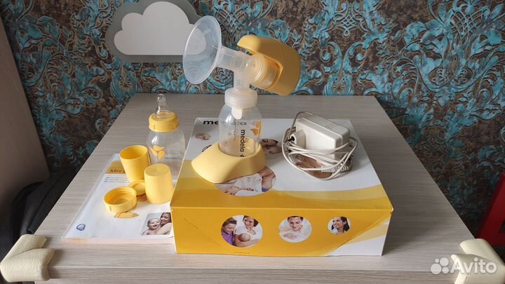 Молокоотсос medela электрический