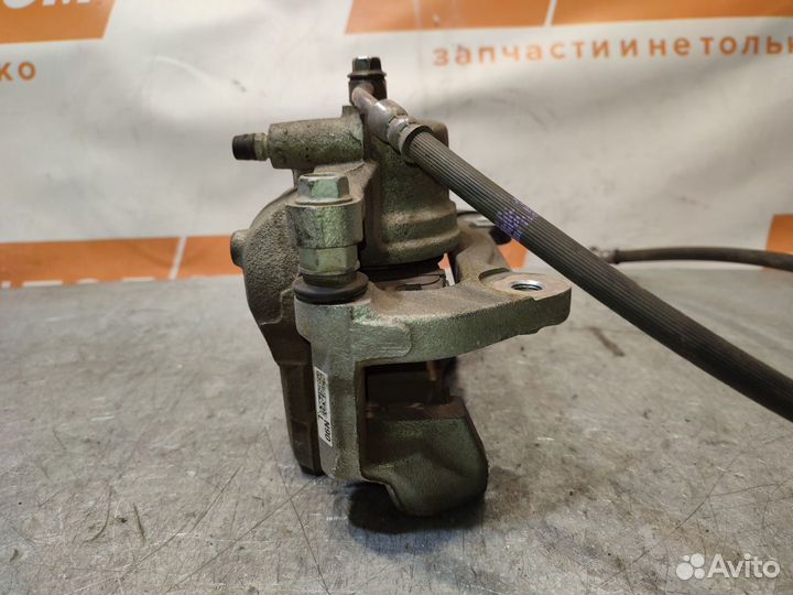 Суппорт тормозной передний левый Kia Sportage 5