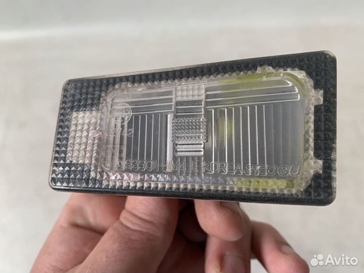 Kia Cerato 13-Фонарь подсветки номера левый