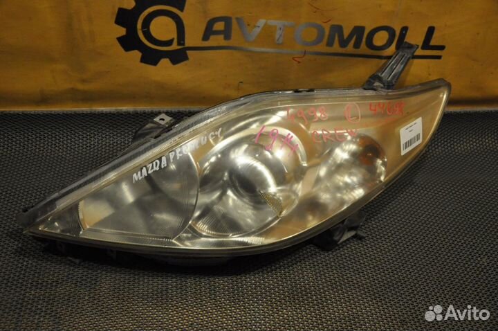 Фара левая mazda premacy crew