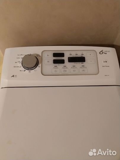 Вертикальная стиральная машина Brandt