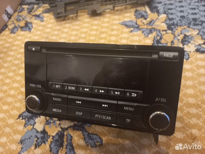 Штатная магнитола с рамкой на Mitsubishi Lancer X