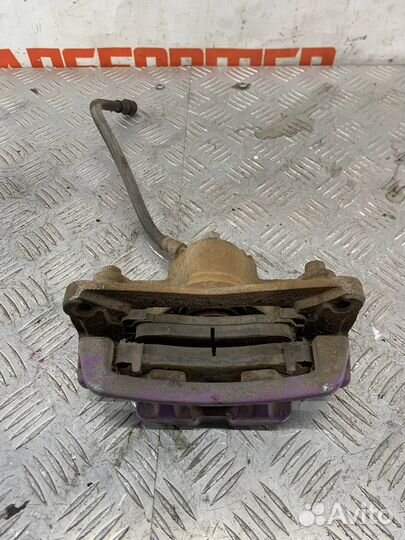 Суппорт тормозной задний левый Мазда Милления TA5P