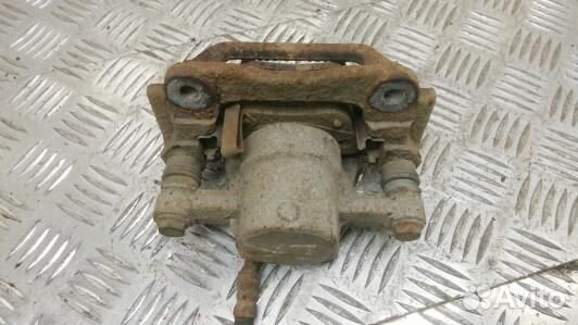 Суппорт тормозной задний левый toyota avensis T25